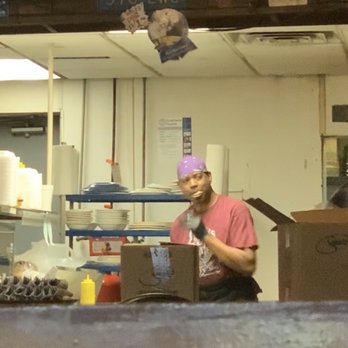 Lupie's Cafe - Cook eating while preparing food. - American Near Me - Charlotte, North Carolina Lupie's Cafe - Cook eating while preparing food. - American Near Me - Charlotte, North Carolina