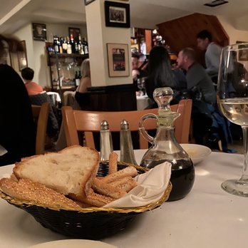 Sam's Place - a plate of bread and a glass of wine - Italian Near Me - New York, New York Sam's Place - a plate of bread and a glass of wine - Italian Near Me - New York, New York