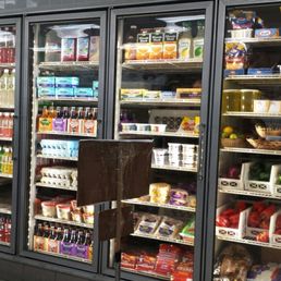 Drinks, dairy products, eggs, and fresh red & green bell peppers among other produce items.