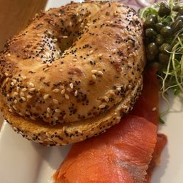 a bagel with salmon and vegetables a bagel with salmon and vegetables
