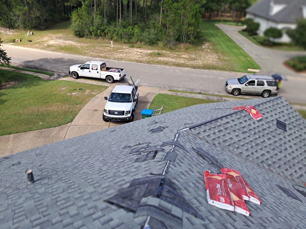 Slide of Three Brothers Roofing