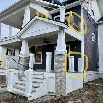 JA Hunters Construction - the front of a house with yellow paint - General Contractors Near Me JA Hunters Construction - the front of a house with yellow paint - General Contractors Near Me