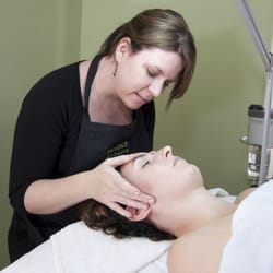 Pearlescent Skin Care - Owner Sarah Clark takes time to fully analyze her client's skin.
