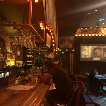Barrel O' Fun -  man sitting at a bar - Bars Near Me - Austin, Texas