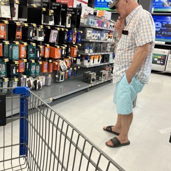 Walmart - a man standing in a shopping cart - Grocery Near Me - Naples, Florida