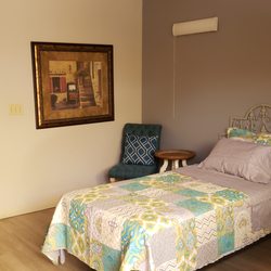 Ventura Villa Assisted Living - View into one of our private rooms with shared bathroom from the courtyard. (Bedroom with courtyard access)