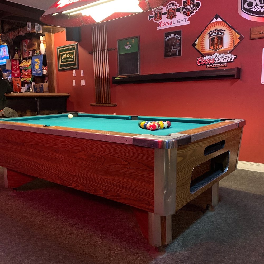 a pool table in a bar