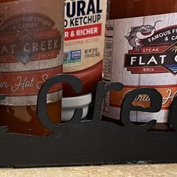 Flat Creek - Flat Creek Hot Sauce Holder, there are 3 different types of Hot Sauce, my favorite was the Garlic-flavored one.