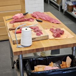 Yard Bull Meats - One of the butcherblock tables with fresh meat being packed on top.