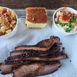 Mac n cheese, cornbread, potato salad, and their brisket. Mac n cheese, cornbread, potato salad, and their brisket.