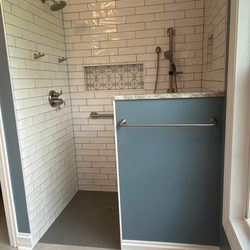 J & R Construction Services - Bathroom remodel in Lexington KY - Curbless shower - shower glass door - grab bars - dual shower heads - tile shower - niches - bench