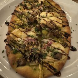 Stone & Oak - December 2023 - Wild mushroom flatbread With basil oil, brie, Parmesan, red onion, and balsamic glaze