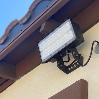 Innovation Electric - RevolveLed flood light installed and mounted on the wall. - Electricians Near Me