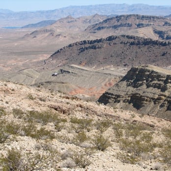 Northshore Peak - In the left, center of the photo is a helicopter flying along the ridge. - Hiking Near Me - Boulder City, Nevada Northshore Peak - In the left, center of the photo is a helicopter flying along the ridge. - Hiking Near Me - Boulder City, Nevada