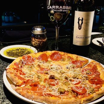 Carrabba's Italian Grill - Pepperoni, Meatball, Sausage and Fresh Garlic Pizza topped with fresh Parm. The food and service is always amazing at this location. - Italian Near Me - Gilbert, Arizona Carrabba's Italian Grill - Pepperoni, Meatball, Sausage and Fresh Garlic Pizza topped with fresh Parm. The food and service is always amazing at this location. - Italian Near Me - Gilbert, Arizona