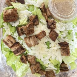 Caesar salad with soggy rye pieces of bread added
