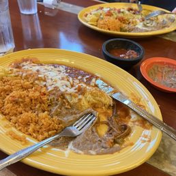 Picadillo burrito (closer) and carnitas burrito Picadillo burrito (closer) and carnitas burrito