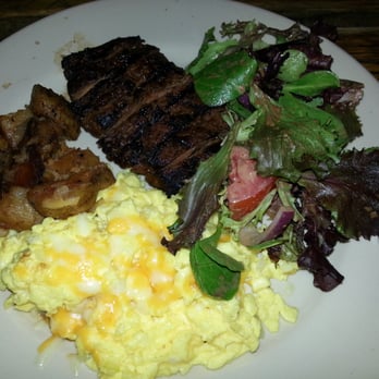 Rustik Tavern - Flank Steak, scrambled eggs, home fries and a SALAD--yum! don't forget to add the bottomless cocktails to your order - American Near Me - Brooklyn, New York