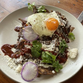 Manuela - Black Beans Chilaquiles, Crema, Fried Egg, Radish, Cilantro - New American Near Me - Los Angeles, California Manuela - Black Beans Chilaquiles, Crema, Fried Egg, Radish, Cilantro - New American Near Me - Los Angeles, California
