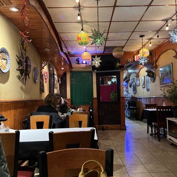 Castro's Restaurant - a woman sitting at a table - Mexican Near Me - Brooklyn, New York Castro's Restaurant - a woman sitting at a table - Mexican Near Me - Brooklyn, New York