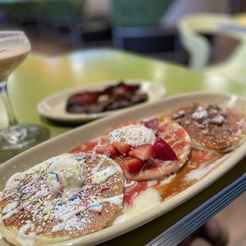 Snooze, an A.M. Eatery - Pancake Flight Customized...confetti, strawberry shortcake and cinnamon Roll - Breakfast & Brunch Near Me - Kansas City, Missouri Snooze, an A.M. Eatery - Pancake Flight Customized...confetti, strawberry shortcake and cinnamon Roll - Breakfast & Brunch Near Me - Kansas City, Missouri
