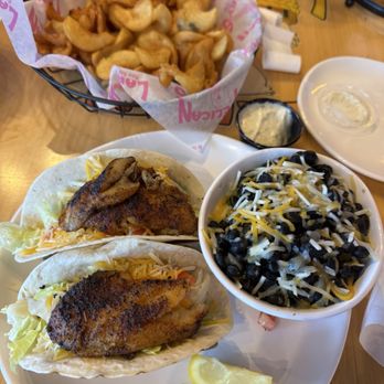 Pelican Larry's Raw Bar and Grill - Grouper tacos, beans and rice with side of fries! - Sports Bars Near Me - Naples, Florida Pelican Larry's Raw Bar and Grill - Grouper tacos, beans and rice with side of fries! - Sports Bars Near Me - Naples, Florida