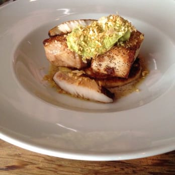 Indigenous Restaurant - Cobia fish with avocado smash and jerk butter on corn cake - New American Near Me - Sarasota, Florida
