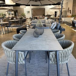 Terra Outdoor Living - Presidio large dining table paired with Palisades dining chairs.