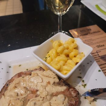 River Town Grill - Bourbon butter pork chop with Mac n cheese - Steakhouses Near Me - Williamstown, West Virginia