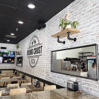 Rising Crust Pizza - Dining area with high and low seating tables which is great for those who might prefer higher or lower seating for mobility. - Pizza Near Me - Walnut, California Rising Crust Pizza - Dining area with high and low seating tables which is great for those who might prefer higher or lower seating for mobility. - Pizza Near Me - Walnut, California