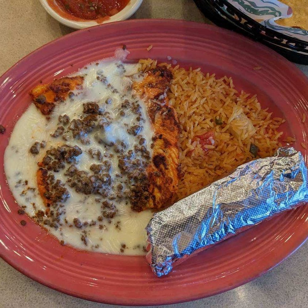 El Jinete - Chorizo polo/chicken covered in cheese sauce with rice and beans - Mexican Near Me - Fairfax, Ohio El Jinete - Chorizo polo/chicken covered in cheese sauce with rice and beans - Mexican Near Me - Fairfax, Ohio