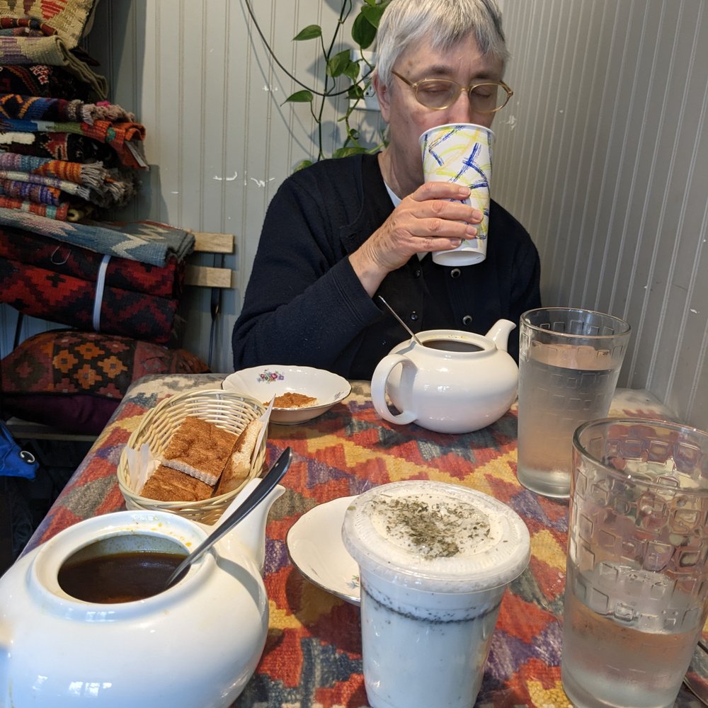 Spring Cafe - Dogh is the yogurt drink in the foreground; you can also see the bread and chickpea stew. - Cafes Near Me - Baltimore, Maryland Spring Cafe - Dogh is the yogurt drink in the foreground; you can also see the bread and chickpea stew. - Cafes Near Me - Baltimore, Maryland