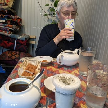 Spring Cafe - Dogh is the yogurt drink in the foreground; you can also see the bread and chickpea stew. - Cafes Near Me - Baltimore, Maryland