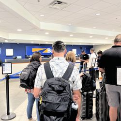 Budget Rent A Car - Long line and 3 people working at counter that should have 18 workers.