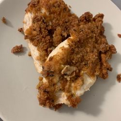 Fried chicke breast pieces. Some of the breading fell off.