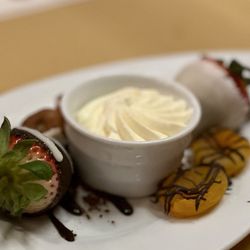 Hugo's Cellar - Dessert included with entree, chocolate strawberries, mango, and fig with whipped cream