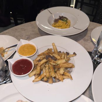 Potente - Truffle Parmesan fries and the petite spaghetti al tartufo Nero - Italian Near Me - Houston, Texas Potente - Truffle Parmesan fries and the petite spaghetti al tartufo Nero - Italian Near Me - Houston, Texas