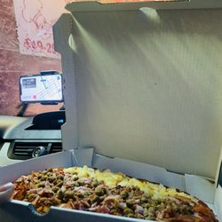 Pizza To Go - 1/2 Pizza Meat Lovers & 1/2 Pizza Hawaiian Pizza. Not too bad for a pit stop!