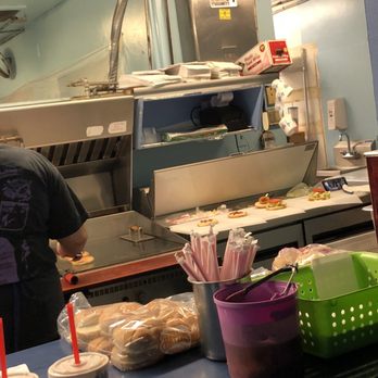 Fosters Freeze - Cell phone is sitting on the work station. Totally gross! - Burgers Near Me - Reedley, California