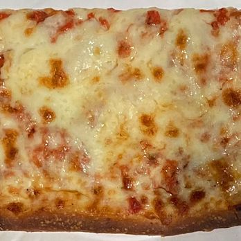 Krave Pizza - Large grandma cheese slice made with a garlicky tomato sauce - Pizza Near Me - New York, New York Krave Pizza - Large grandma cheese slice made with a garlicky tomato sauce - Pizza Near Me - New York, New York