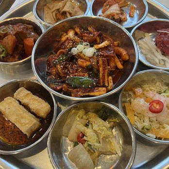 Kisa - The squid entree with 7 different banchan - Korean Near Me - New York, New York