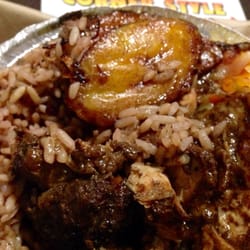Corner Style Jamaican & American - Medium sized Jerk Chicken with Rice beans.  A spicy, filling, hearty meal.