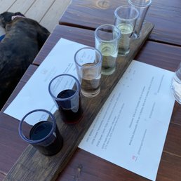 Wine flight on the shaded and breezy patio which was a good thing on a hot day. Wine flight on the shaded and breezy patio which was a good thing on a hot day.