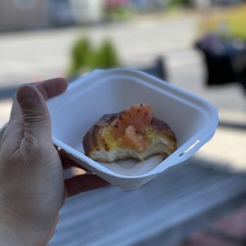 The Buttery - a hand holding a small container of food - Bakeries Near Me - Malvern, Pennsylvania The Buttery - a hand holding a small container of food - Bakeries Near Me - Malvern, Pennsylvania