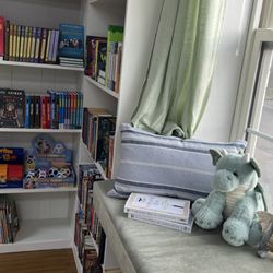 The Story Peddler Bookstore - Our book dragons setting in to the children's window seat to enjoy a new read by a local author.