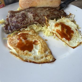 Giorgio's Bakery & Bistro - New York strip and eggs (added hot sauce) - Bakeries Near Me - Hollywood, Florida Giorgio's Bakery & Bistro - New York strip and eggs (added hot sauce) - Bakeries Near Me - Hollywood, Florida