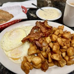 Stockyard Restaurant - Breakfast Special with eggs, bacon, side of sausage gravy, potatoes, toast, coffee.   Breakfast Special Breakfast Special
