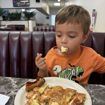 Rise and Dine - Happy boy with his pancake - Breakfast & Brunch Near Me - Chula Vista, California