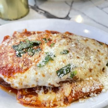Fumo - a plate of lasagna on a marble table - Pizza Near Me - New York, New York Fumo - a plate of lasagna on a marble table - Pizza Near Me - New York, New York
