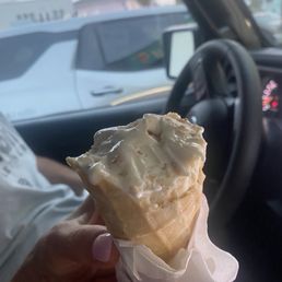 Toasted coconut ice cream on a homemade ice cream cone. Toasted coconut ice cream on a homemade ice cream cone.
